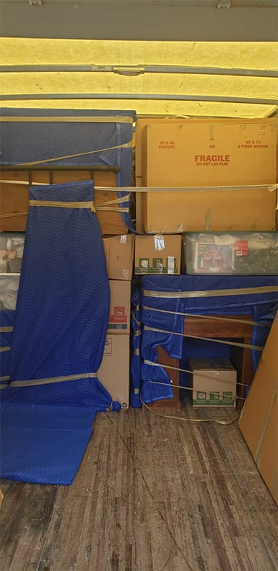 Secured packages and furniture in large moving truck